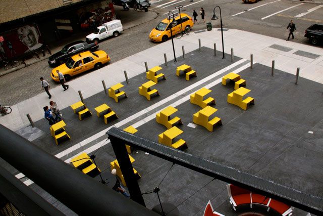 The yellow chairs are part of the High Line. They're at the base of the building that straddles the HL diagonal from Hogs and Heffers.